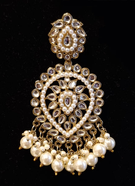 Designer kundan and pearl layered rani haar with earrings and tikka.