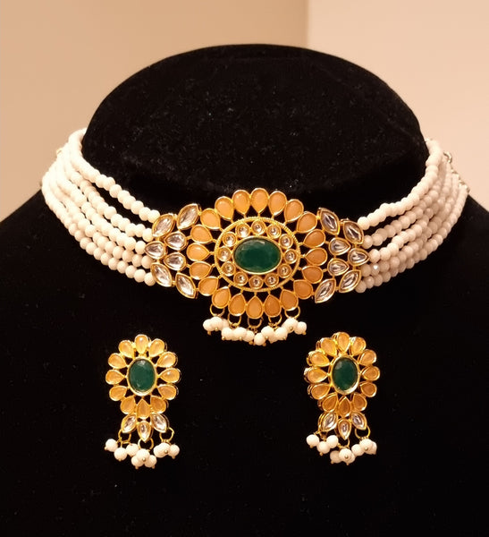 Kundan stones pearl choker necklace with earrings.