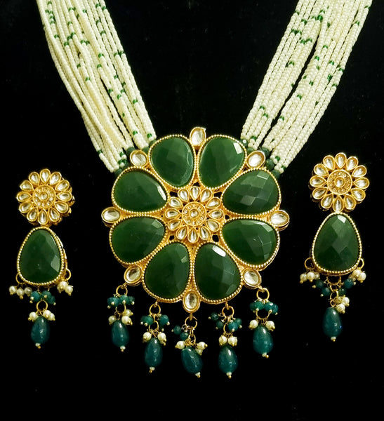 Multi - Strand pearl haram with kundan and emerald stones necklace set with earrings.