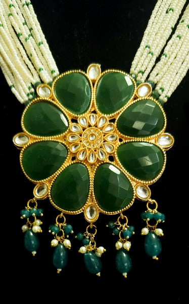 Multi - Strand pearl haram with kundan and emerald stones necklace set with earrings.
