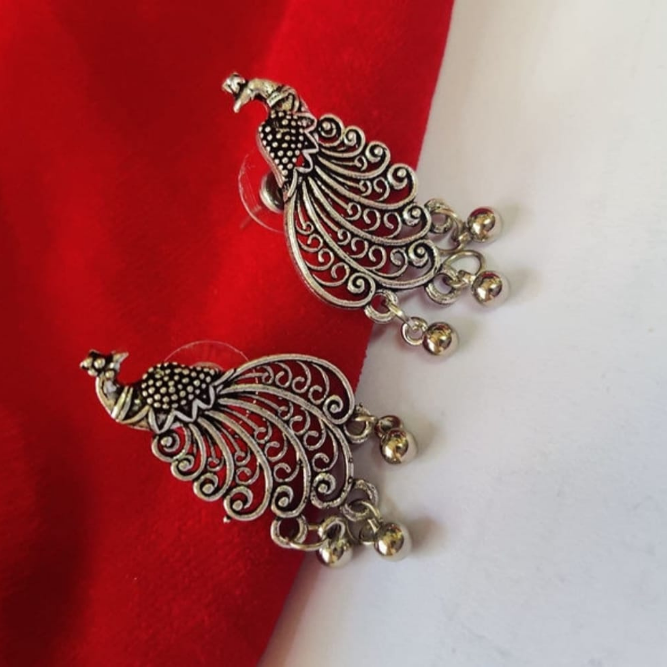 Oxidized peacock stud earrings
