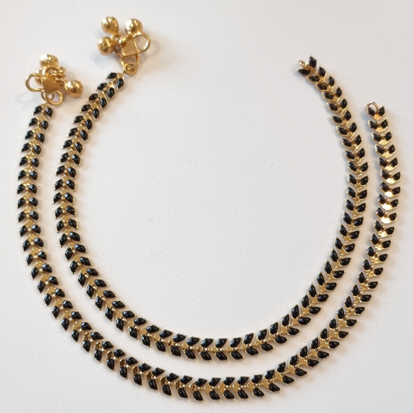 Gold plated with black enamel anklet.