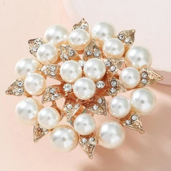 Faux pearl and rhinestone flower ring.